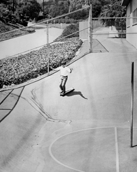Terry Keller nose-ride on skateboard, Kenter Canyon Elementary School, 1964