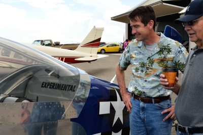 Troy Wilson & George Whitman admire Wilson's homemade airplane