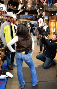 Michael Newman tries boots at Solano's Boot & Western Wear