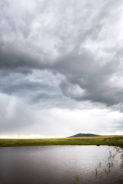 Full stock pond atop Johnson Mesa