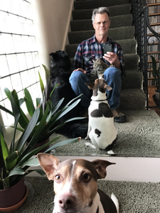 Tim Keller and dogs and cat at home after hike
