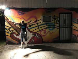 Christina Boyce plays with the night light in San Marcos, Texas