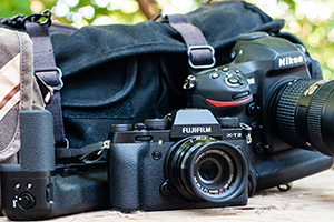 Fujifilm X-T2 with 35mm lens, beside Nikon D5
