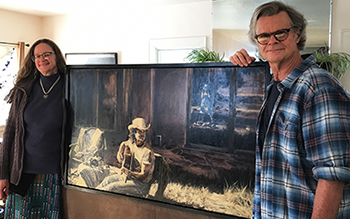 Christina Boyce and Tim Keller at home in Raton, New Mexico, with their Lindsay Hand painting, "Serafina, 1988"