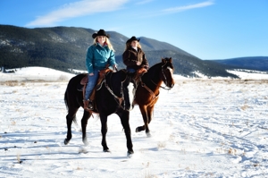 Janna Mills & Ashlee Rose Mills horseback in Eagle Nest winter