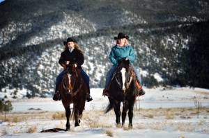 Janna Mills & Ashlee Rose Mills horseback in Eagle Nest winter